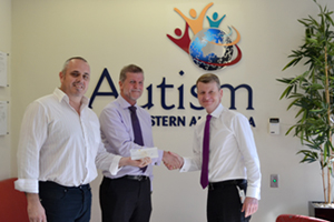 Airpac Rentals Operations Manager, Jon Denham and Director - Australia, Graham Pemberton, hand over a cheque to Autism Association of Western Australia.
